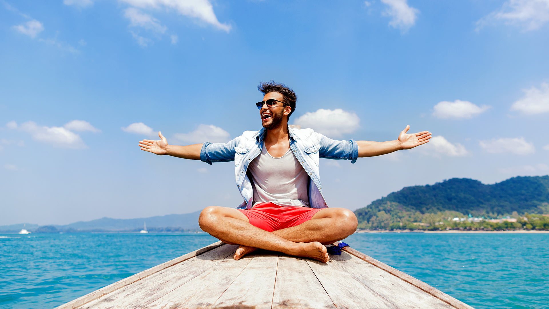 young man tourist sail long tail thailand boat ocean sea vacation travel trip