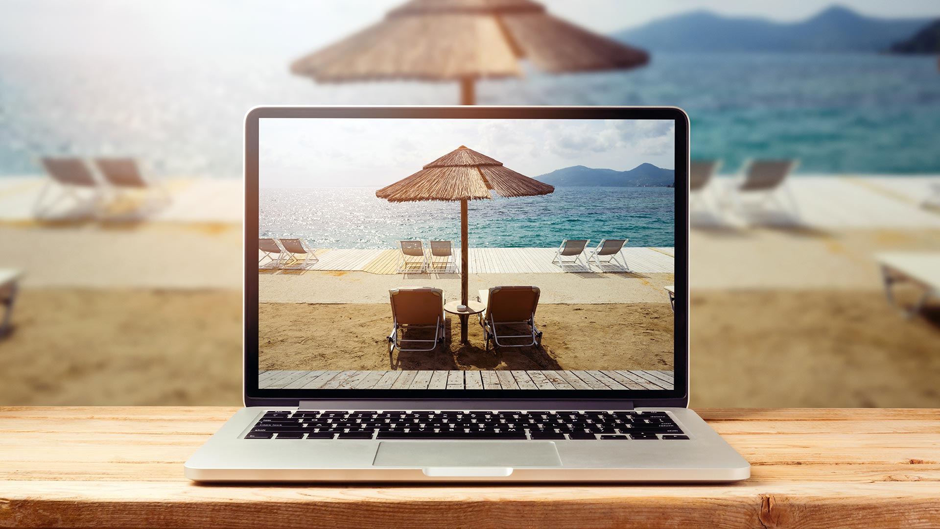 laptop with sunny beach image